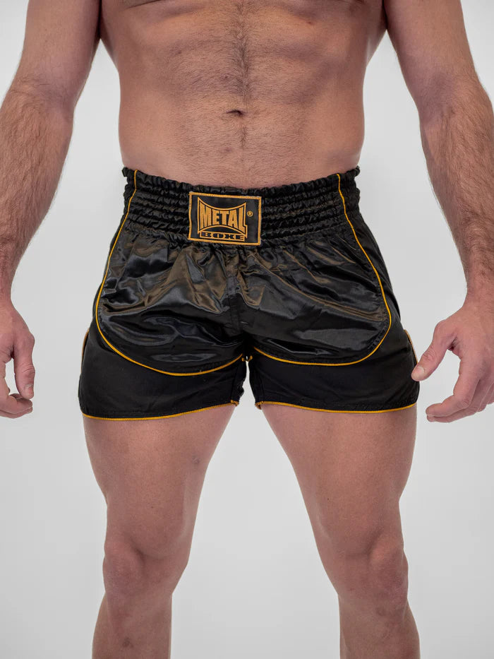 Vista frontale pantaloncini Kickboxing uomo Metal Boxe Siam nero oro