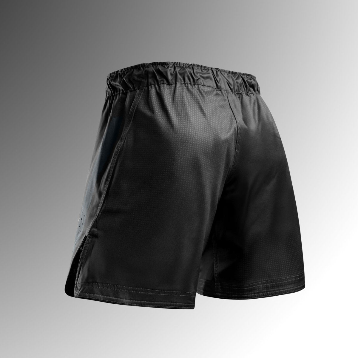 Rückansicht der schwarzen Hayabusa Core Mid-Thigh MMA Shorts aus reißfestem Stoff für No-Gi