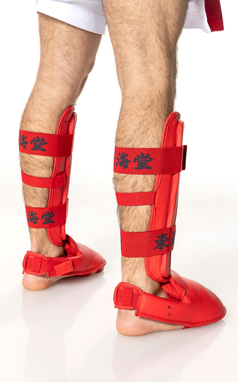 Set protezione gambe Tokaido rosso in PU resistente con imbottitura anatomica.