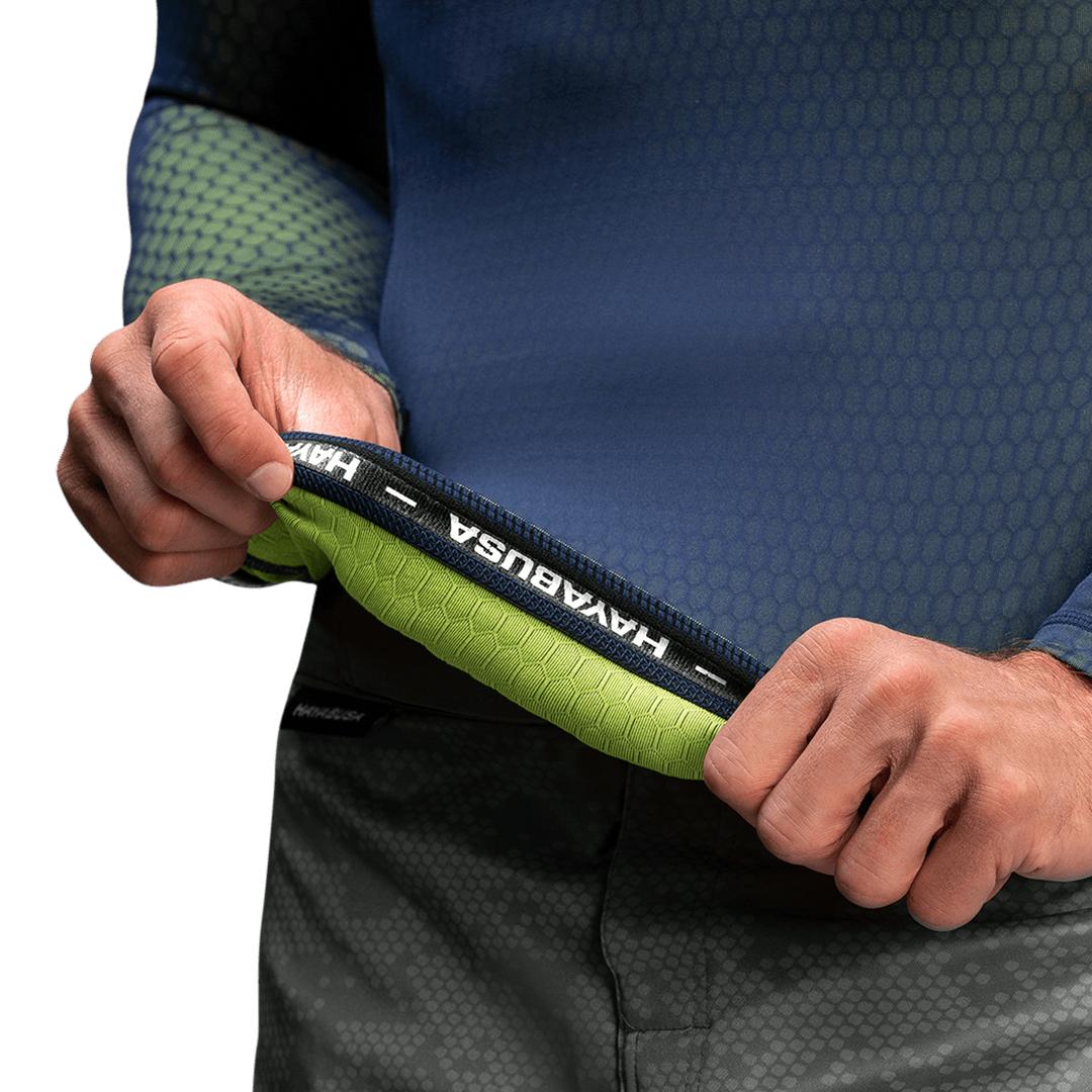 Détail interne du rashguard Hayabusa Fusion bleu/vert, montrant le grip en silicone antidérapant