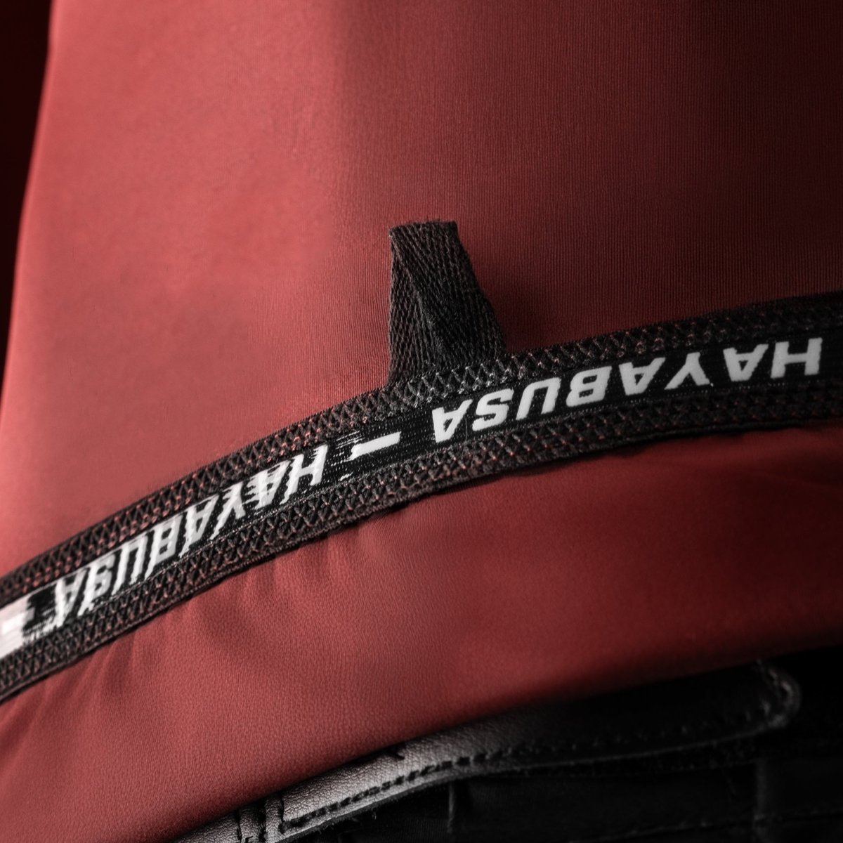 Technical detail of the internal writing on the neck on the red Hayabusa Core rashguard
