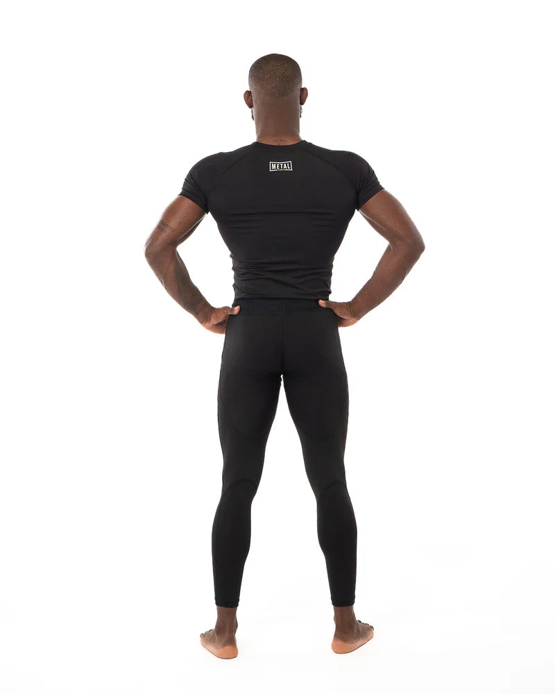 Vista posteriore rashguard Metal Boxe nera supporto muscolare e libertà di movimento