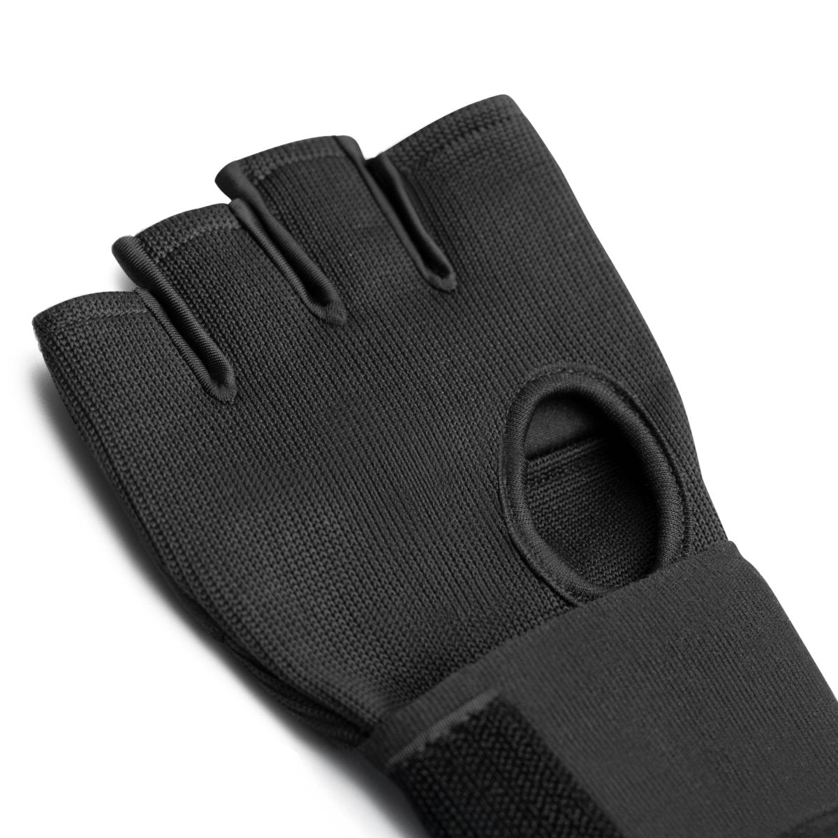 View of the inside palm of the worn Mayweather Deluxe Quick Wrap glove, showing the elastic closures and the open palm