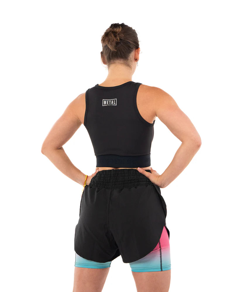 Vista posteriore della canotta compressiva donna Metal Boxe nera con copertura integrale della schiena