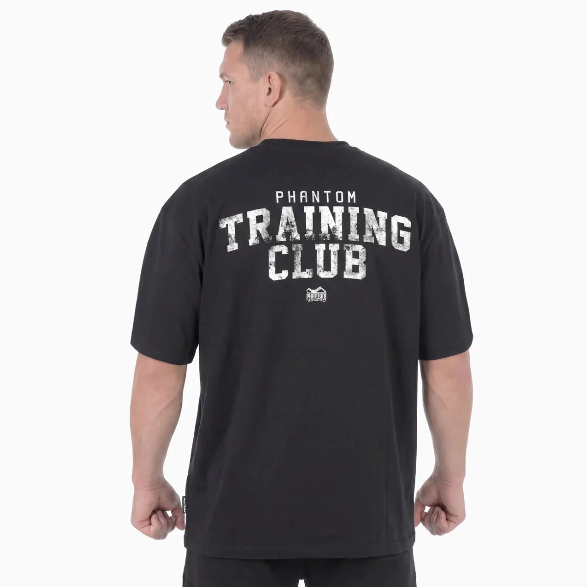 Vista traseira da camiseta preta superdimensionada do Phantom com o grande gráfico do Training Club nas costas