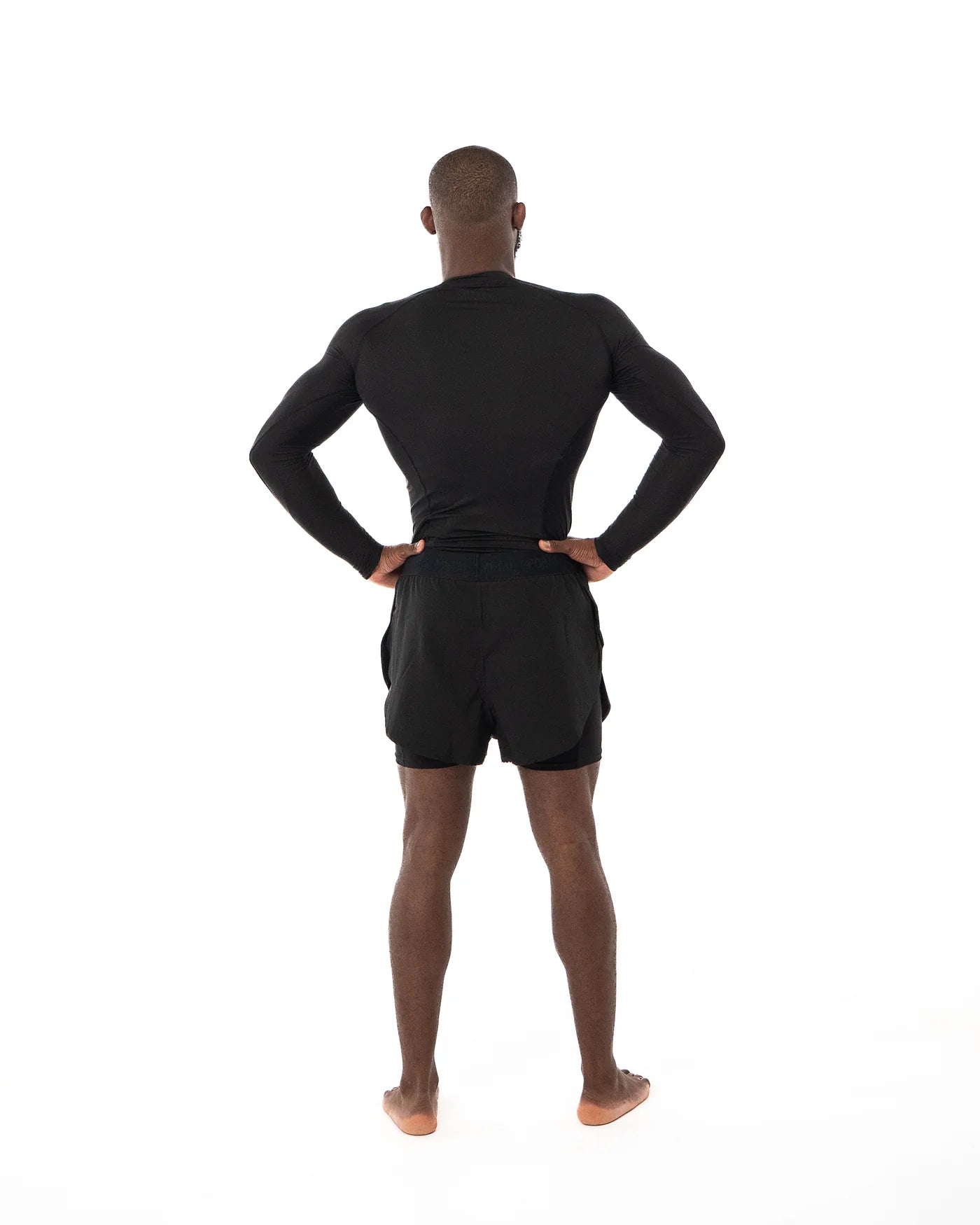 Vista posteriore degli shorts 2in1 Metal Boxe neri, dettaglio del fit compressivo