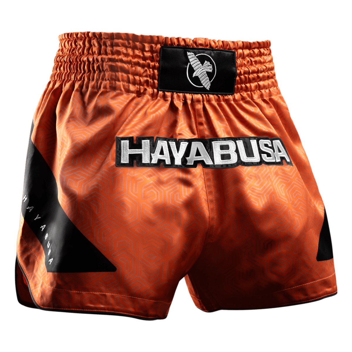 Orange Muay Thai Hayabusa Core-shorts sedda framifrån i satintyg