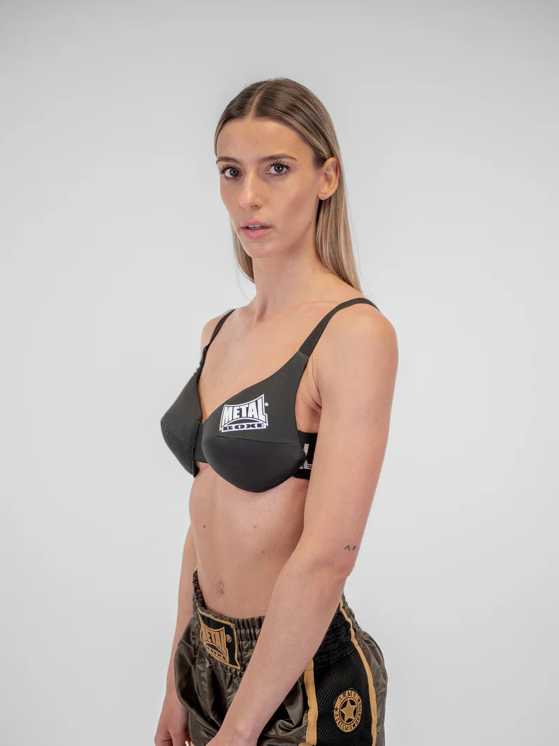Vista laterale del paraseno Metal Boxe che evidenzia lo spessore dell'imbottitura e il design ergonomico