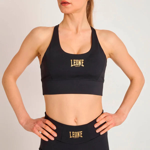 Vista frontale del top sportivo nero Leone DNA con fit compressivo