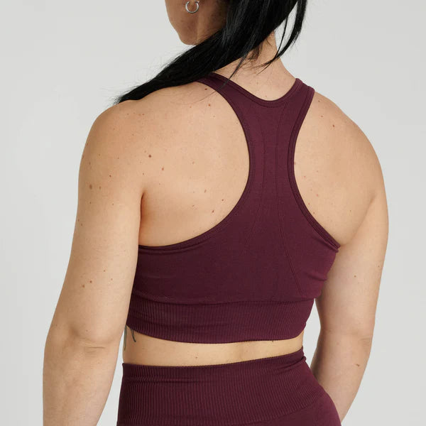 Vista posteriore del reggiseno tecnico color melanzana senza cuciture